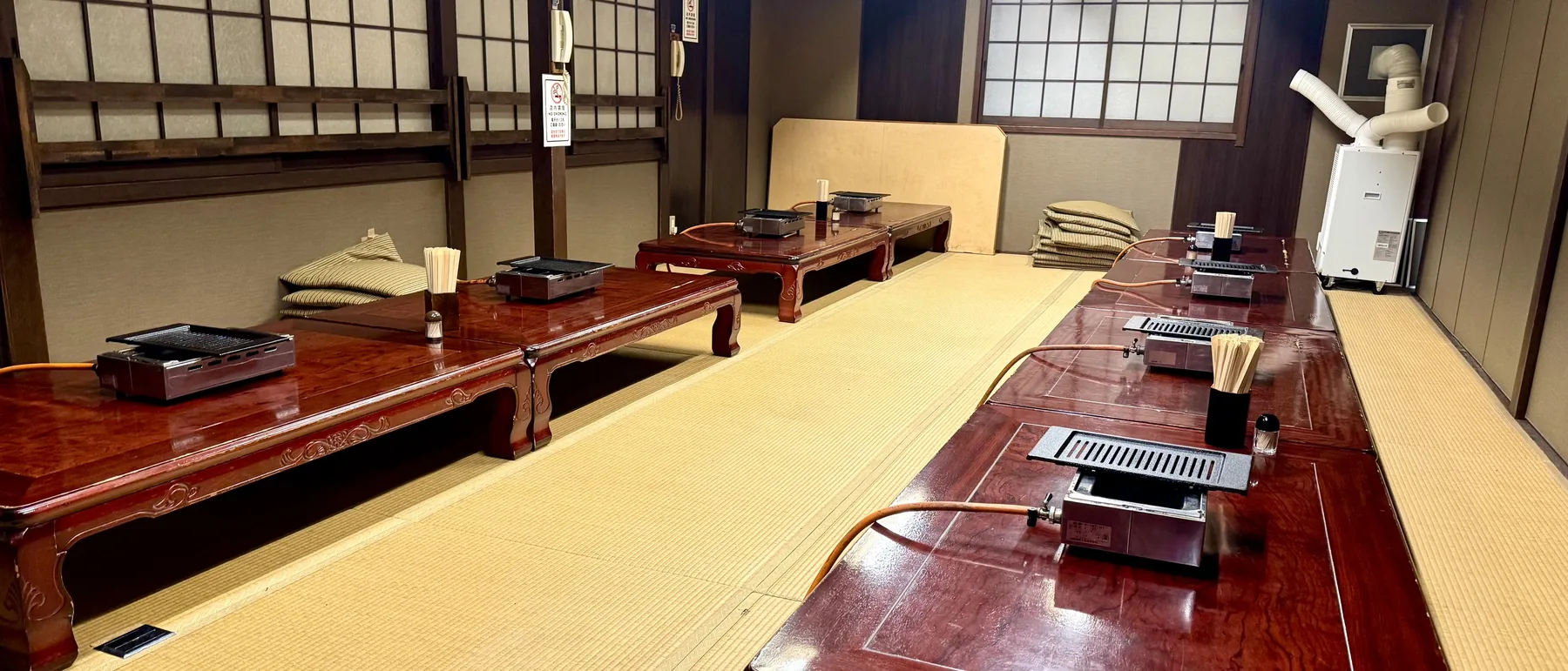 A long tatami room with low tables